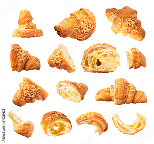 Cut out fresh classic french croissant sprinkled with nuts isolated on white background. Whole and broken croissant. With clipping path. Sweet pastry, bun, dessert. Food objects for design