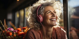 active senior woman enjoying music using headphones.
