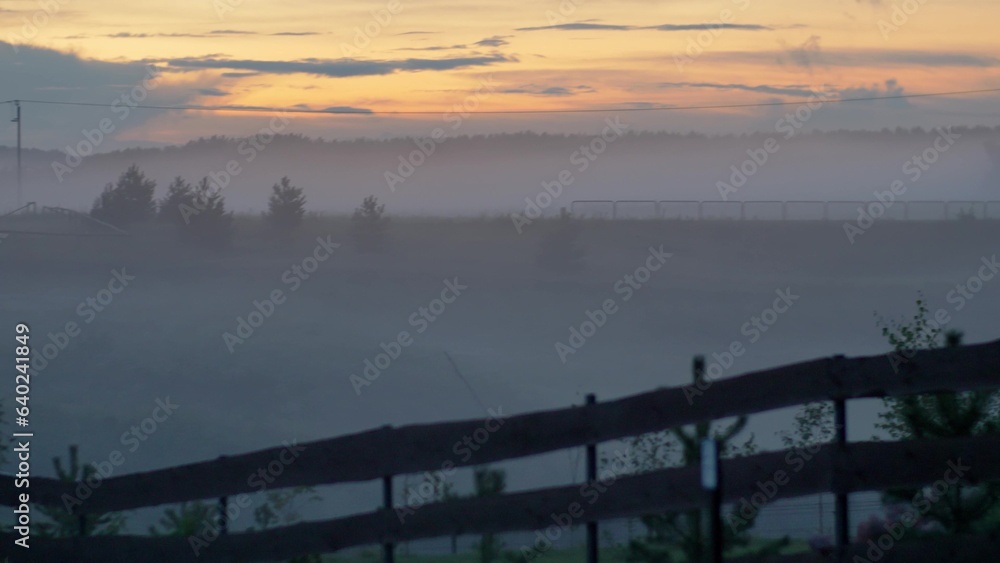 Countryside Rural Landscape Covered in Dense Fog After Sunset