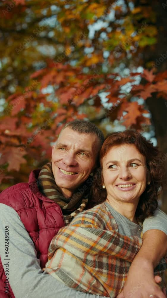 Hello autumn. happy romantic couple in the park embracing. Hello autumn. happy romantic couple in the park embracing.