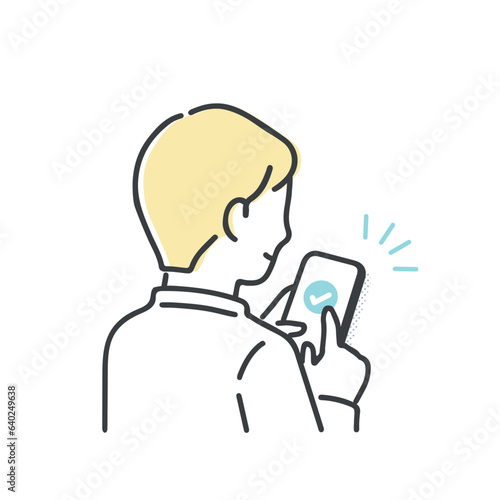 スマホを操作する若い男性