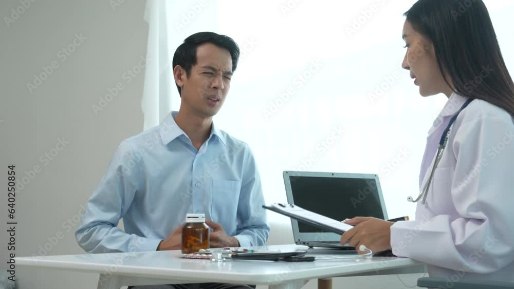 4k slow motion of asian female doctor specialist and male patient discussing Flu (influenza) is infection of nose, throat, lungs, respiratory system. head, body aches, sore throat, fever, respiratory 4k slow motion of asian female doctor specialist and male patient discussing Flu (influenza) is infection of nose, throat, lungs, respiratory system. head, body aches, sore throat, fever, respiratory