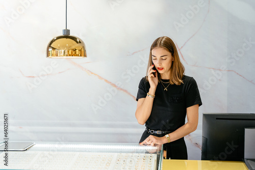 Tableau sur toile Portrait of charming elegant woman in jewelry store