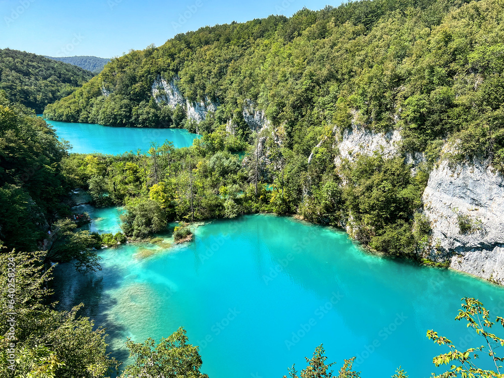 Turquoise waters of Croatia's lakes encircled by green