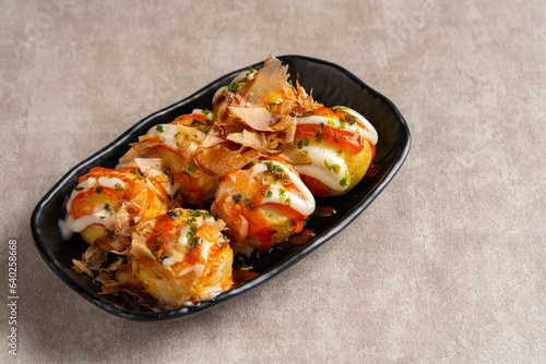 Takoyaki is a ball-shaped Japanese snack made of a wheat flour-based batter and cooked in a special molded pan
