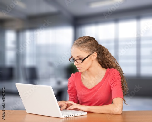 Young professional happy business woman working on laptop, AI generated image