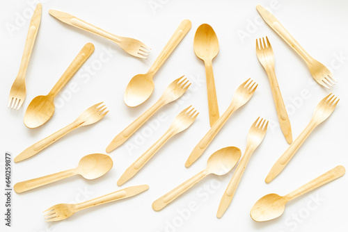 Pattern of wooden disposable cutlery. Eco friendly background