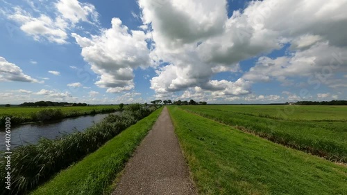 River Eem and polder bicycle path near Eemdijk in the Netherlands photo