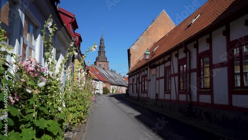 Cobblestone Street in Old Town with Housing in Ystad Midtown overlooking Church and City Center, Skane Sweden. photo