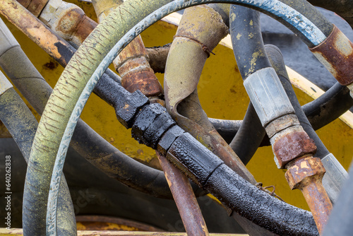Hydraulic oil leak at the hydraulic hose assembly.Oil leak hydraulic line