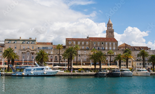 The waterfront of the historic coastal city of Split in Dalmatia, Croatia. This part of the waterfront is known as Riva. The Cathedral of Saint Domnius bell tower is centre right