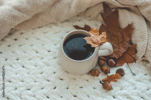 Cup of hot tea and a leaf, autumn mood