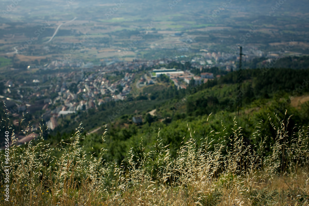 Landscape of the mountains of the Serra da Estrela with the city in blur in the background in Portugal.