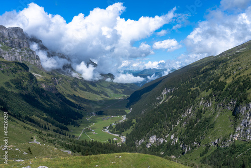 Valley in Alps on blue sky © Nikolaos