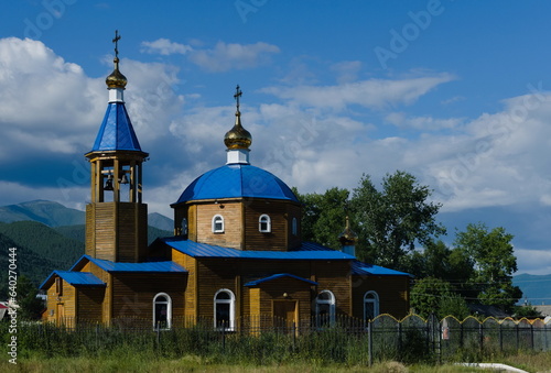 Obraz na płótnie Russian orthodox church temple at among trees and clouds