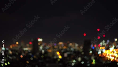 Blurred of night city skyscraper and tower lights bokeh , Soft Focus , Metropolis Backgound wallpaper for movie or documentary romantic mood concept 