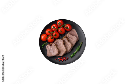 Delicious boiled beef tongue sliced with vegetables and spices