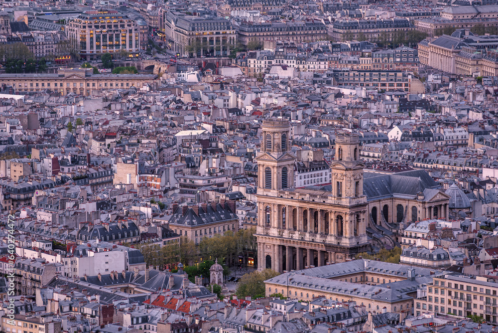 Birdseye view of the Saint-Sulpice Church with the downtown of Paris, France during twilight 