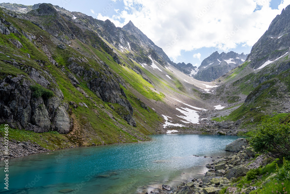 Turquoise blue Mountain lake in the swiss alps in Kanton uri - obrazy, fototapety, plakaty 