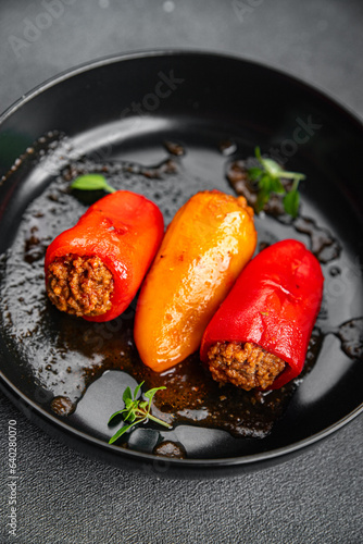 stuffed pepper meat stuffing bell pepper paprika pork, beef, chicken meat second course meal food snack on the table copy space food background rustic top view 
