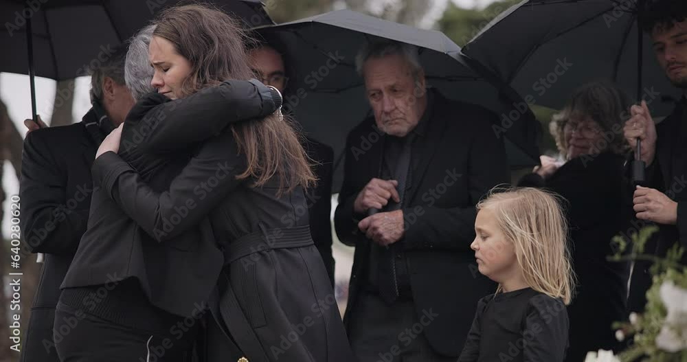Funeral, crying family and people hug for grief support, mourning depression and death at emotional burial event. Kid child, mom and group together with widow hugging senior mother at coffin ceremony
