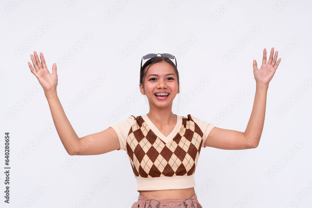 An astonished young asian woman gasping while expressing something large with her hands. Isolated on a white background. An astonished young asian woman gasping while expressing something large with her hands. Isolated on a white background.