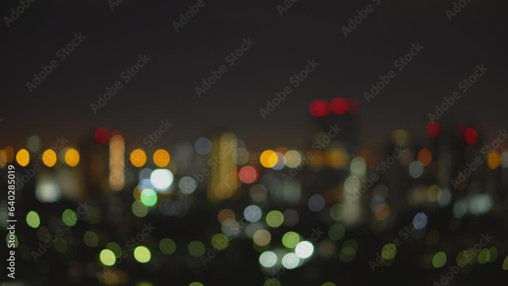 Blurred of night city skyscraper and tower lights bokeh , Soft Focus , Metropolis Backgound wallpaper for movie or documentary romantic mood concept 