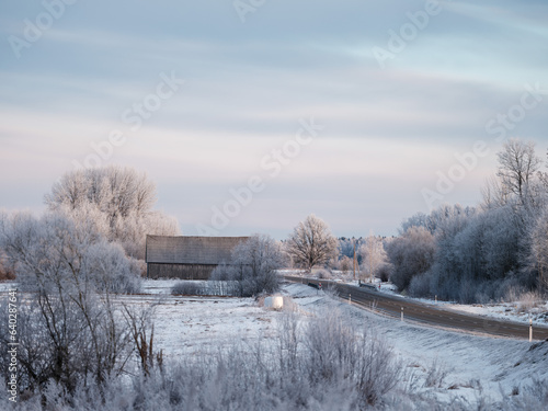 Landscape with winter road covered in ice © Martins Vanags