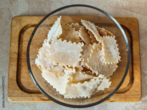 Noodles in a glass bowl on the table photo