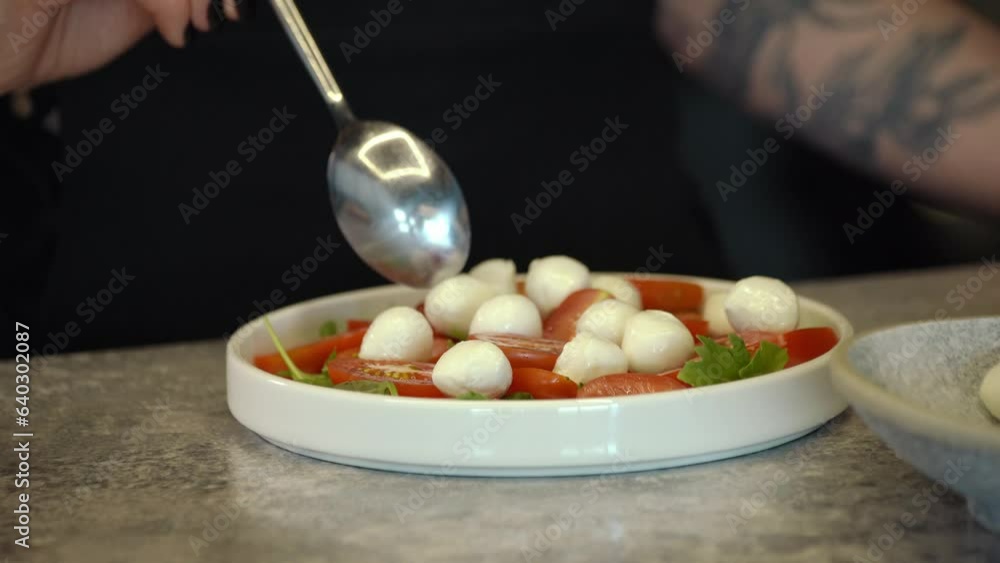 Mozzarella cheese balls and red cherry tomato, Turning. selective focus