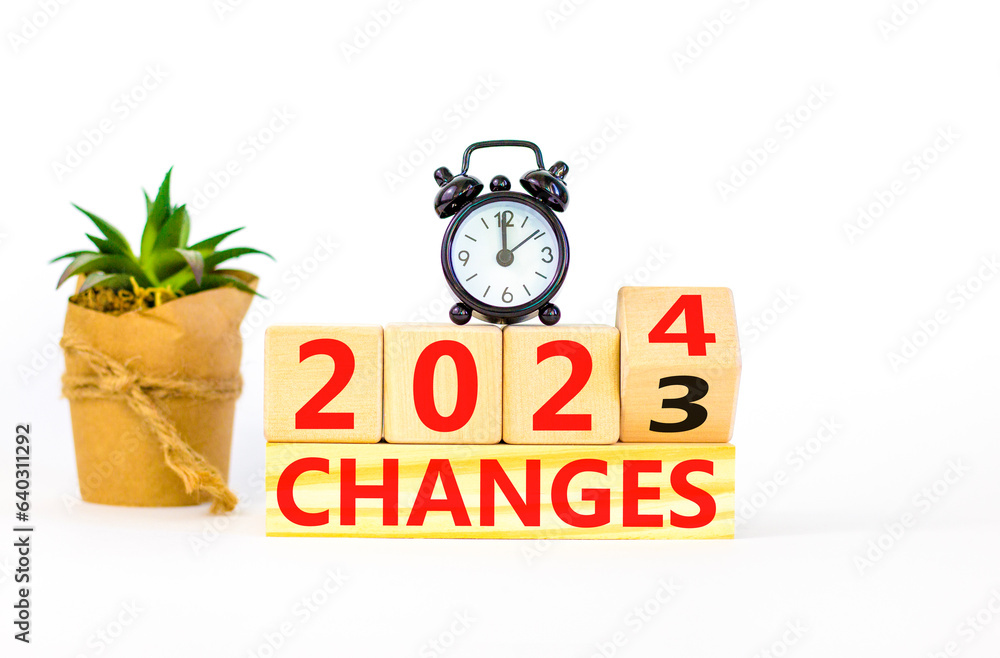 Planning 2025 changes new year symbol. Businessman turns a wooden cube