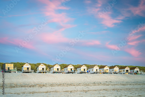 Row of rentable tiny homes along the dutch sea coast