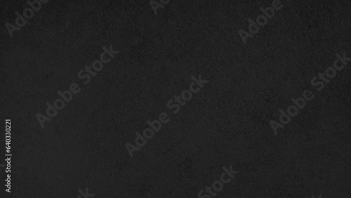 dark black sandstone tile used as background with blank space for design. modern black and white distress concrete texture for background in vintage tone. architectural flooring texture.