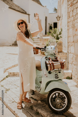 A young woman in a white dr...