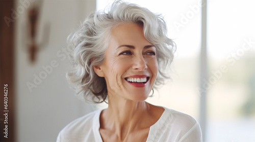 Beautiful senior model. Elderly women portrait with smiling face.  © XtravaganT