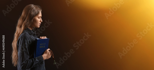 Praying young woman with Ho...
