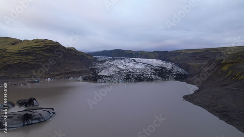 Aerial view of the Solheimajokull is an outlet glacier of the mighty icecap of Myrdalsjokull on the South Coast of Iceland. It is the fourth-largest ice cap in Iceland. photo