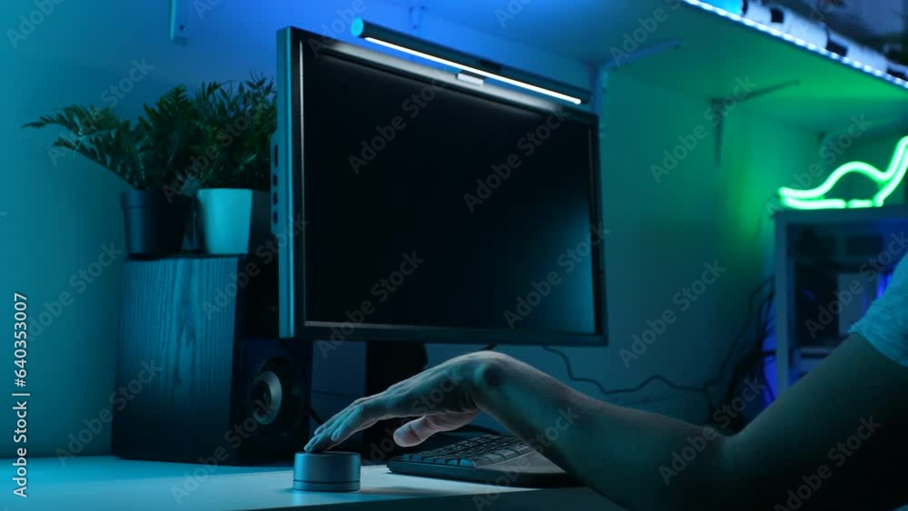 Men. Computer Vled Close-up hands of unrecognizable man adjusting light level of new LED ...