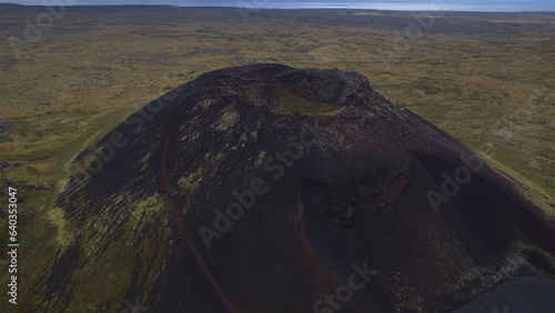 Saxholl is a 45 meter high volcanic, ovalshaped crater. It rises up from the moss-covered lavafields in Snaefellsjokull National Park on the Snaefellsnes peninsula West Iceland. photo