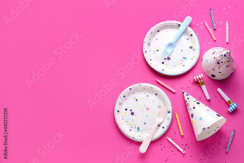 Paper disposable tableware and different party decor on pink background