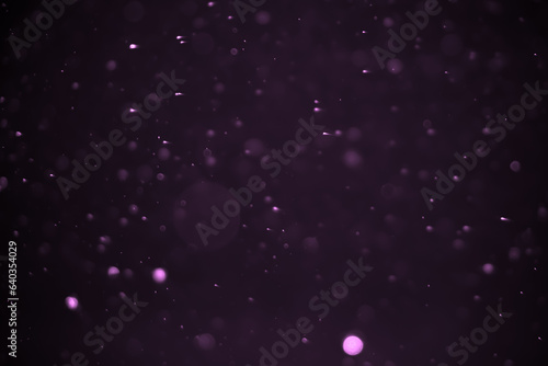 Abstract bokeh lights with purple background