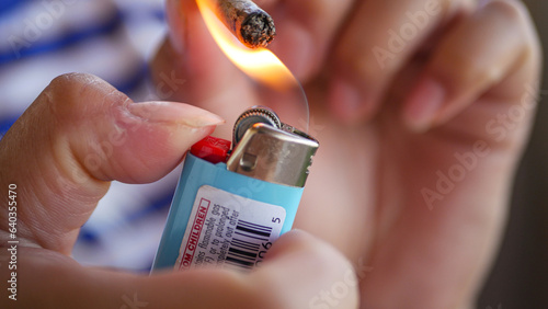 flame toughing weed cigarette