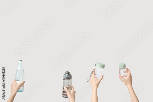 Female hands with bottles o...