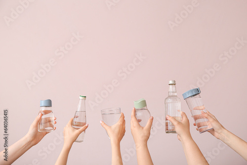 Multiple hands holding vari...