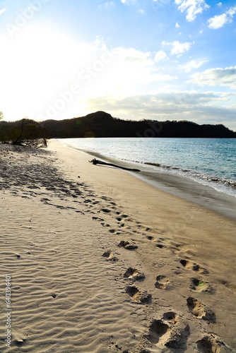 Sunset with foot print at Playa Pacifica, Guanacaste, Costarica
