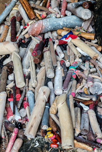 Pile of wooden carved penises at  Princess cave (Phra Nang Shrine Temple). South Railay beach in Krabi. Thailand. photo