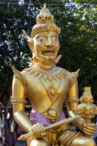 Fotografie Demon King sits on his golden throne, with a pile of skulls, Thailand
