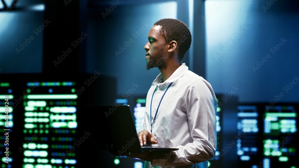 IT programmer setting up high tech facility advanced firewalls, intrusion detection systems and security updates. Cybersecurity supervisor preventing hacking, malware, and denial of service attacks IT programmer setting up high tech facility advanced firewalls, intrusion detection systems and security updates. Cybersecurity supervisor preventing hacking, malware, and denial of service attacks