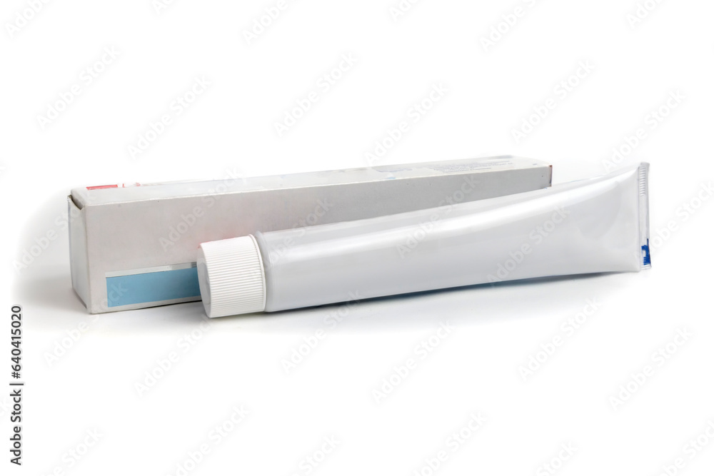 A tube of toothpaste with a box. A tube of toothpaste with a box.