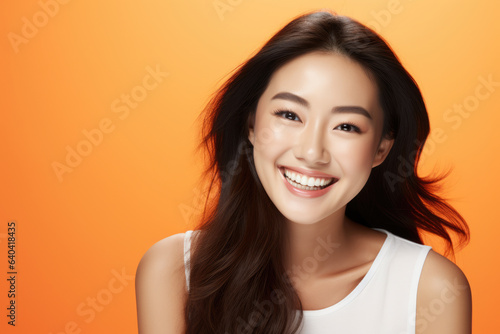 Woman with long brown hair smiling at camera. This picture can be used for various purposes such as advertisements, blog posts, or social media content.